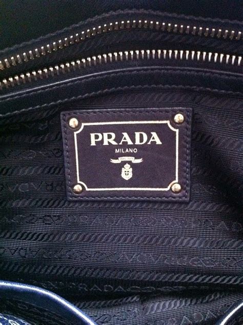 do all prada bags have interior pockets|Prada leather bag.